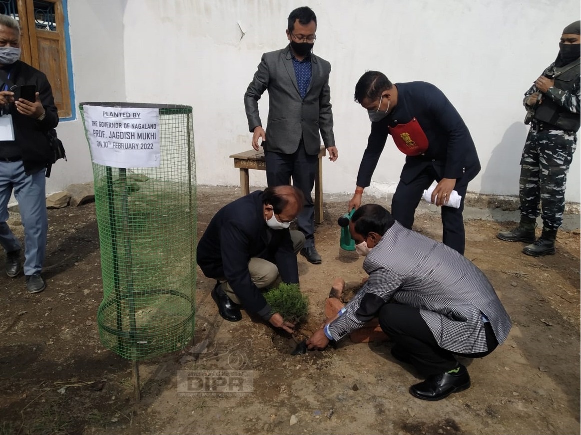Prof Jagdish Mukhi is seen planting a tree at Government Higher Secondary School Kiphire
