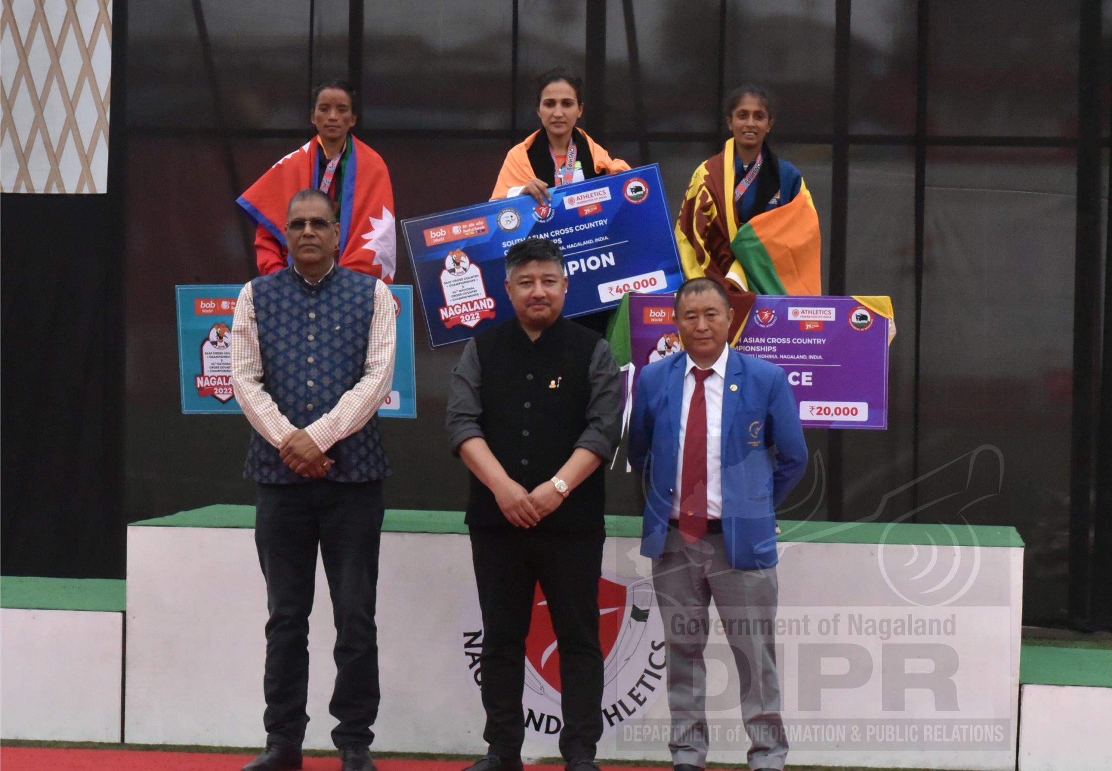Associate Vice President AFI, Abu Metha and dignitaries with the winners of Women (10km) SAAF and National event at IG stadium, Kohima