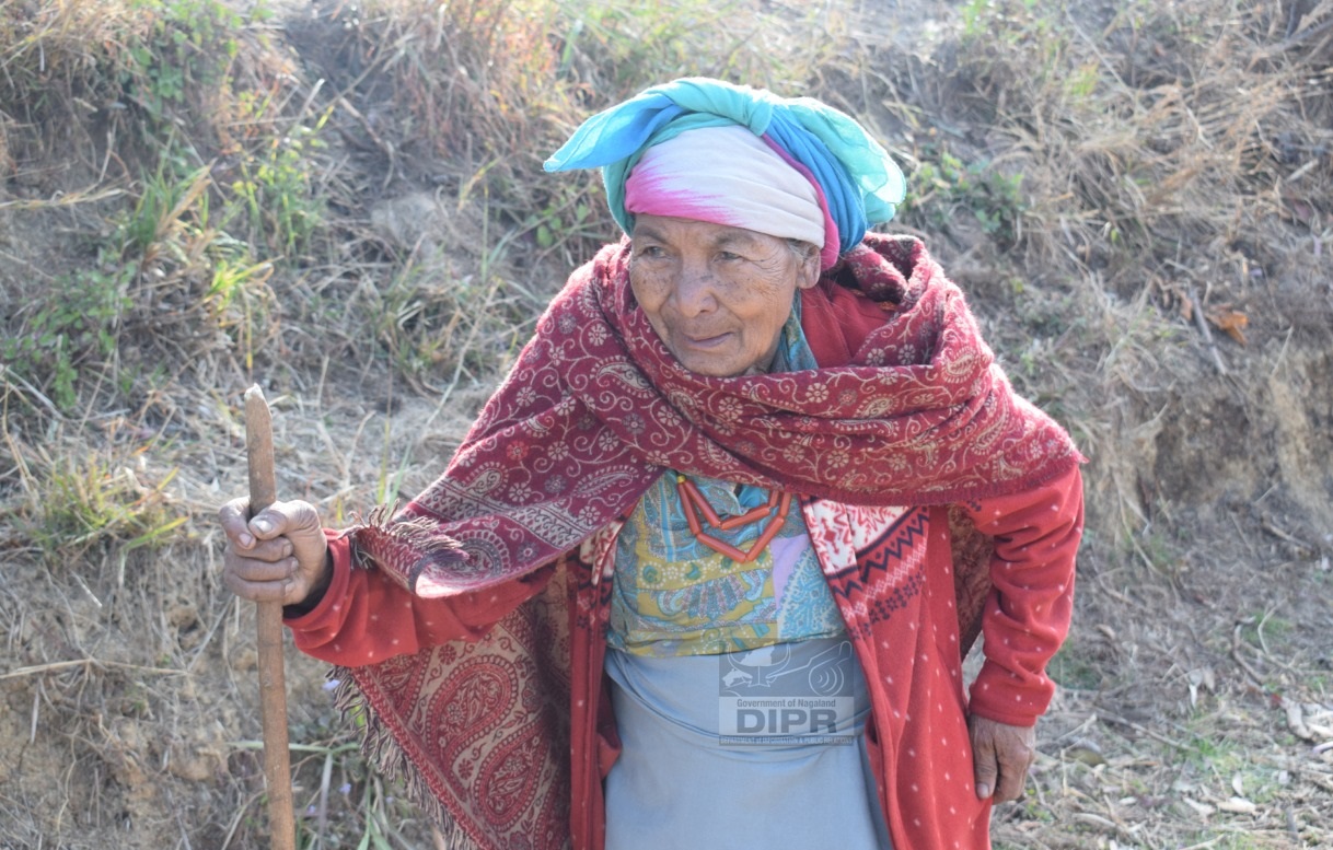 A senior citizen proceeding towards the Polling Station to cast her vote at 71-Peren