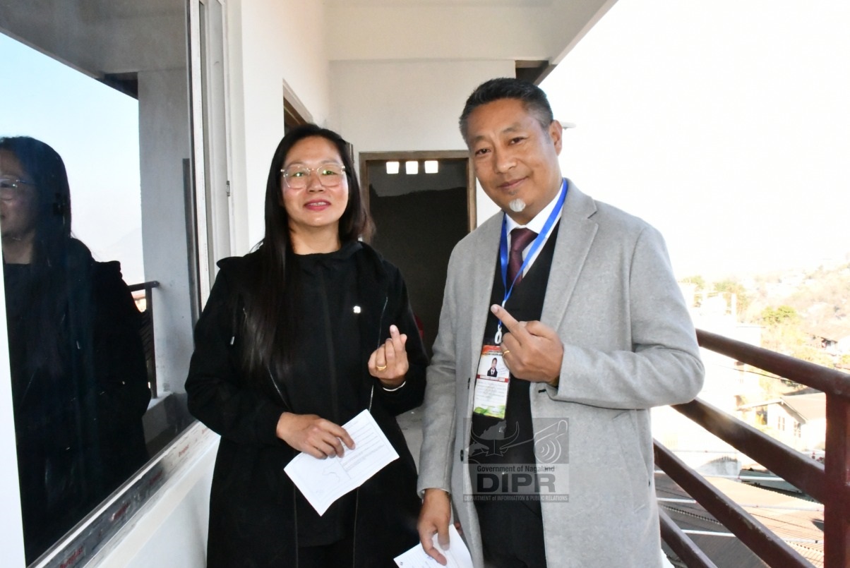 Dr. Tseilhoutuo Rhutso NPP Candidate 9 Kohima Town AC and his wife pose for lens after casting their votes at Polling Station No. 5, Nagabazar Lower, Kohima
