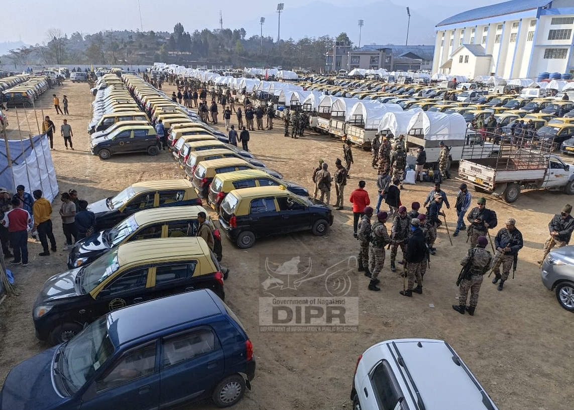 Vehicles and security personnel moving out from IG Stadium to the collecting and receiving centre at DC office Kohima