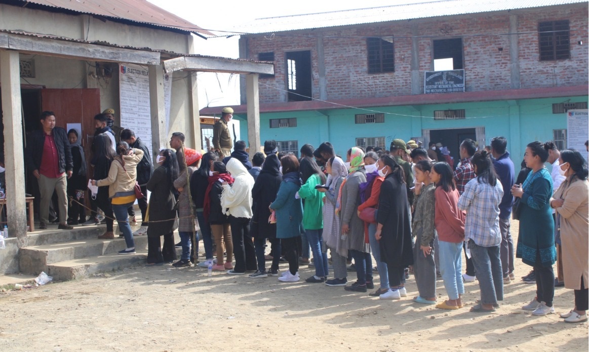 Voters stands in queue to cast their votes at Zunheboto