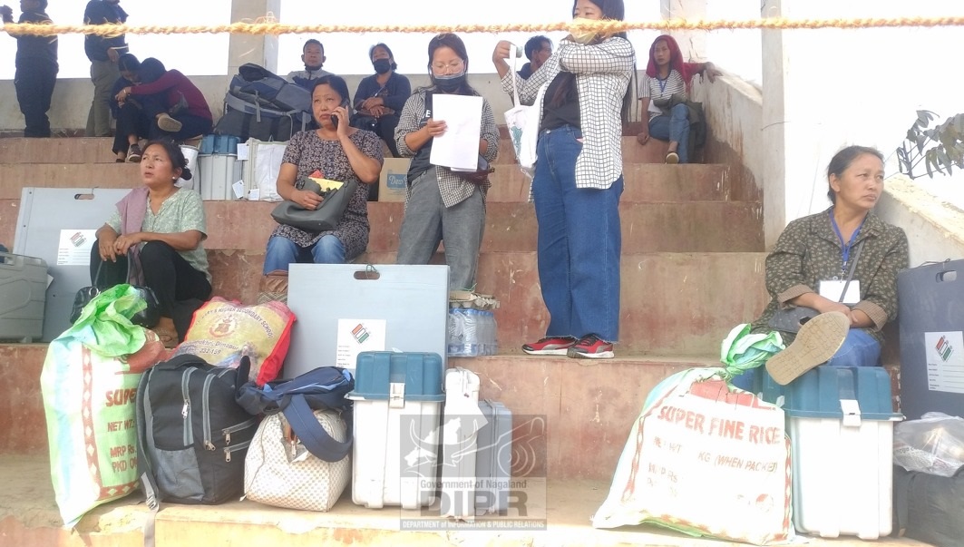 Women polling personnel waiting at vehicle transit camp at Longleng