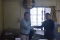 DC MOKOKCHUNG PRESENTING CERTIFICATE TO DISTRICT GREEN CHAMPION CERTIFICATE TO MOKOKCHUNG COLLEGE OF TEACHER EDUCATION