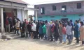 Voters stands in queue to cast their votes at Zunheboto